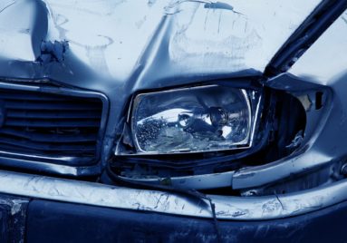 car with front fender bent from an accident