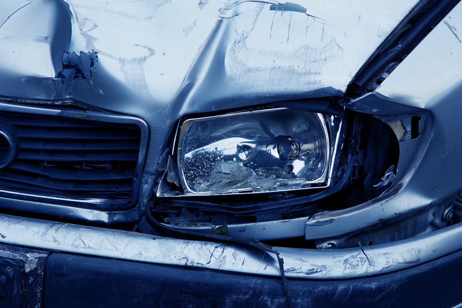 car with front fender bent from an accident