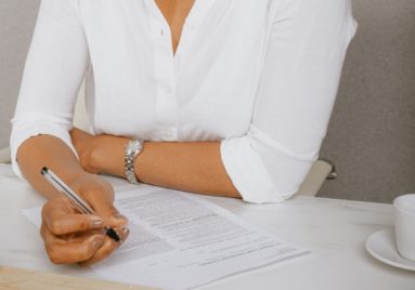 black woman signing contract