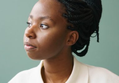 confident african american woman looking away in studio
