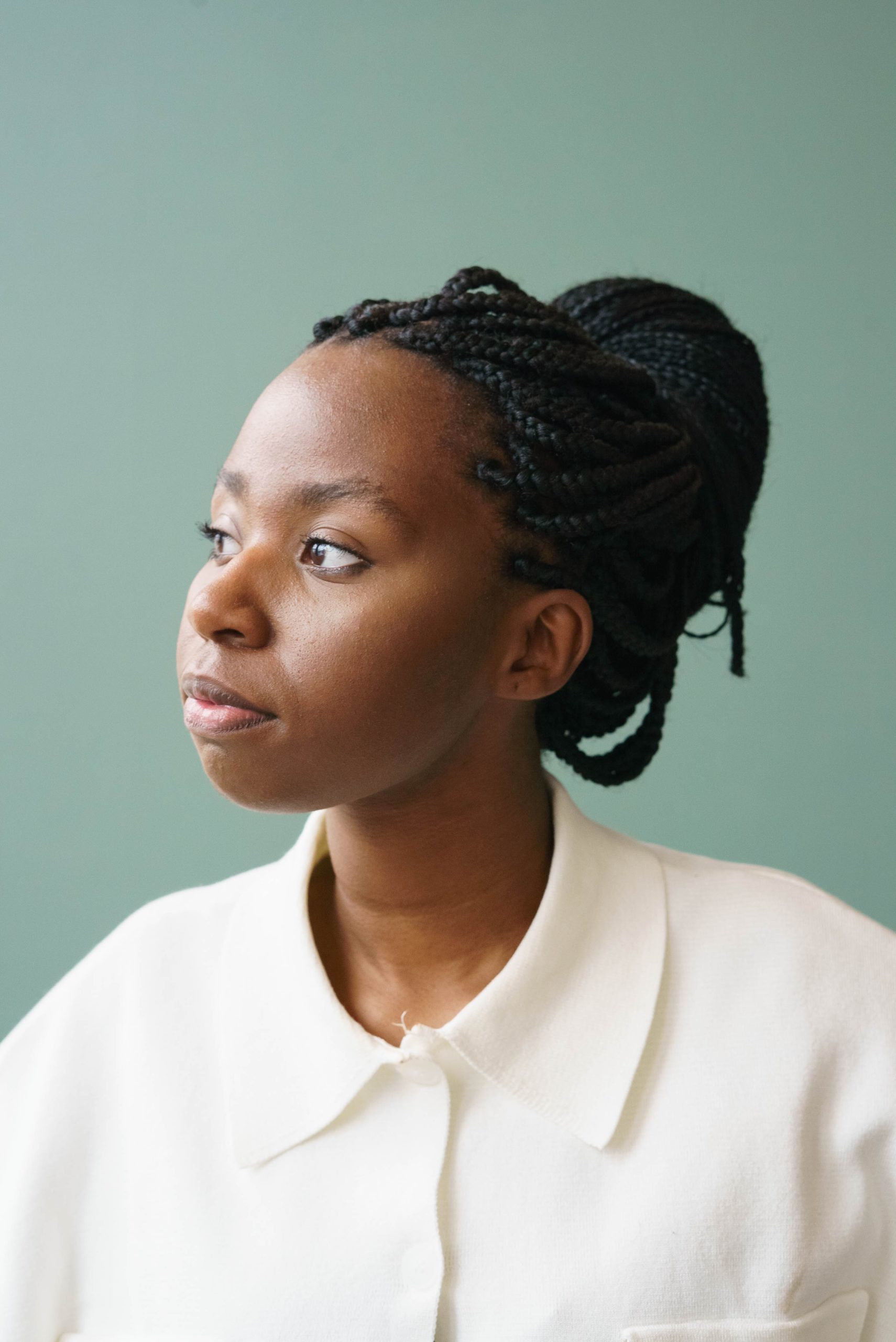 confident african american woman looking away in studio