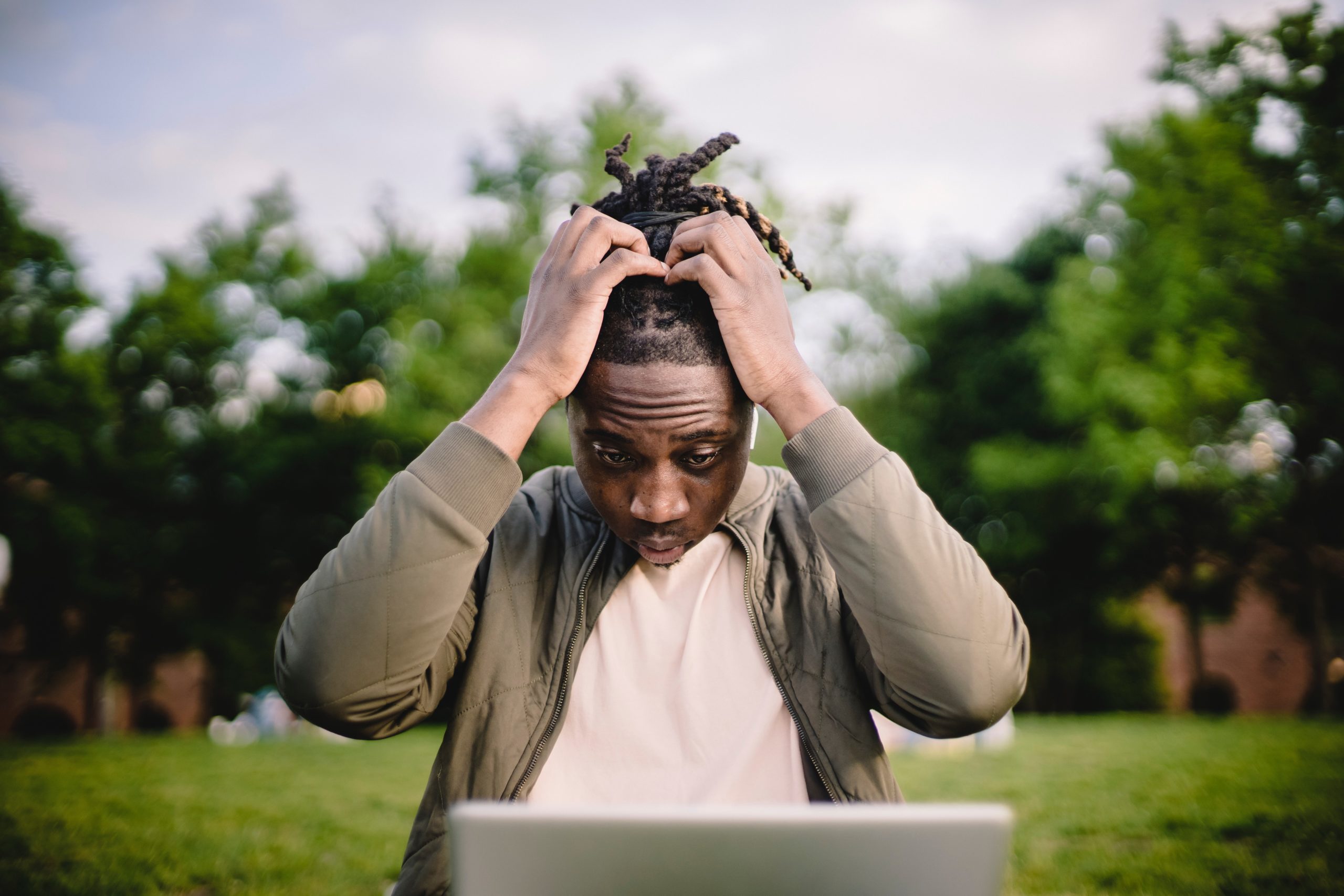 anxious man looking at computer