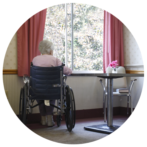 elderly person sitting in a wheelchair near a window who has been neglected at a nursing and needs ATLANTA NURSING HOME NEGLECT LAWYERS